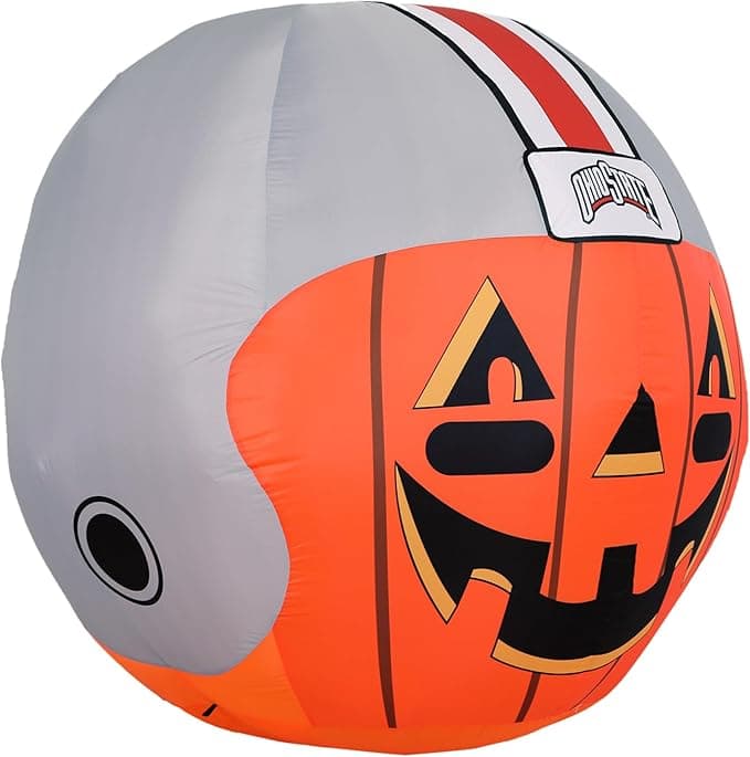 Fire TV remote resting next to a festive pumpkin display